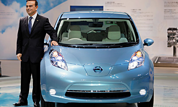 Nissan Motor Co. CEO Carlos Ghosn poses with the automaker' zero